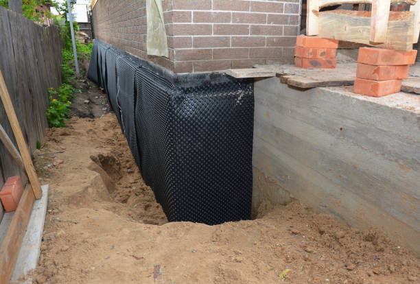 SJ Waterproofing Pros technician performing targeted Exterior Waterproofing assessment in Albion, MI